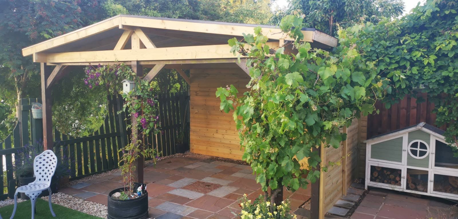 Garden patio area with wooden covered structure